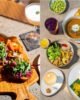 Collage of top gourmet travel destinations featuring luxury dining experiences